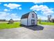 Exterior shot of barn including large door on a sunny day at 1585 S 600 W, New Palestine, IN 46163