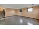 Finished basement area featuring durable flooring, ample natural light, and convenient staircase at 1585 S 600 W, New Palestine, IN 46163