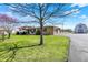 Well-maintained exterior view of house with a long driveway, barn, and storage shed at 1585 S 600 W, New Palestine, IN 46163