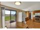 Bright kitchen with stainless steel appliances, wood cabinets, and a sliding glass door to enjoy indoor-outdoor living at 1585 S 600 W, New Palestine, IN 46163