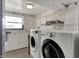 Basement laundry room equipped with washer, dryer, and utility sink plus some storage space at 1585 S 600 W, New Palestine, IN 46163