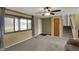 Inviting living room features plush carpet, neutral paint, bright windows, and staircase access for comfortable living at 1585 S 600 W, New Palestine, IN 46163
