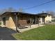 Exterior patio with a swing, grill, and brick facade at 1585 S 600 W, New Palestine, IN 46163