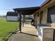 View of the patio with a grill and storage box outside a brick home at 1585 S 600 W, New Palestine, IN 46163