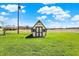 Exterior shot of shed, located near the front of the property on a sunny day at 1585 S 600 W, New Palestine, IN 46163