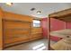 A storage area with shelves against bright walls with overhead lighting and a small window at 1585 S 600 W, New Palestine, IN 46163