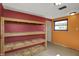 A storage area featuring shelves against bright walls with overhead lighting and a window at 1585 S 600 W, New Palestine, IN 46163