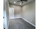 Bedroom with gray carpet and a white door at 1809 S H St, Elwood, IN 46036