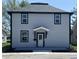 Charming two-story home with gray siding, black trim, and a covered front entrance at 1809 S H St, Elwood, IN 46036