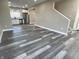 Bright living space with modern flooring leading to an updated kitchen, perfect for entertaining at 1809 S H St, Elwood, IN 46036