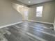 Inviting living room with modern flooring and a view of the front door, offering a welcoming feel at 1809 S H St, Elwood, IN 46036