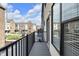 Balcony view showcases townhomes, a courtyard, and a relaxing outdoor living space at 1842 Central Ave, Indianapolis, IN 46202