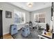 Bright basement area featuring exercise machines, large windows, and ample space for a home gym setup at 1842 Central Ave, Indianapolis, IN 46202