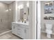 Bathroom featuring double sink vanity, a glass shower, and separate toilet area at 1842 Central Ave, Indianapolis, IN 46202