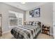Comfortable bedroom with a window and cozy decor, creating a relaxing atmosphere for rest and rejuvenation at 1842 Central Ave, Indianapolis, IN 46202