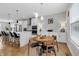 Cozy dining area features a round table, modern lighting, and opens to the kitchen area at 1842 Central Ave, Indianapolis, IN 46202
