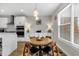 Comfortable dining area with classic table and chairs and modern lighting at 1842 Central Ave, Indianapolis, IN 46202