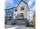 Rear exterior view of the townhouse with garage and balcony, offering modern design and outdoor living appeal at 1842 Central Ave, Indianapolis, IN 46202