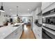 Bright kitchen featuring stainless appliances, a central island, and an open layout to the living area at 1842 Central Ave, Indianapolis, IN 46202