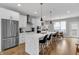 Bright open kitchen featuring a large island, stainless steel appliances, sleek cabinets, and a spacious layout at 1842 Central Ave, Indianapolis, IN 46202