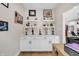 Organized office space with built-in cabinets and decorative shelving for collectibles at 1842 Central Ave, Indianapolis, IN 46202