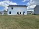 View of the home's backyard which features ample lawn space and patio furniture at 1862 Cascades Dr, Greenfield, IN 46140