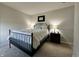 Comfortable bedroom with a metal bed frame and side tables with lamps at 1862 Cascades Dr, Greenfield, IN 46140