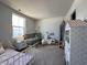 Bedroom featuring twin beds, a crib, and a charming play kitchen at 1862 Cascades Dr, Greenfield, IN 46140