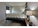 A peaceful bedroom with light gray walls, white bedding, and side tables at 1862 Cascades Dr, Greenfield, IN 46140