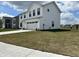 Spacious home featuring vinyl siding, well-maintained lawn, and an attached two-car garage at 1862 Cascades Dr, Greenfield, IN 46140