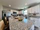 Bright kitchen showcases granite countertops, stainless appliances, ample cabinets, and pendant lighting at 1862 Cascades Dr, Greenfield, IN 46140
