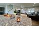 Open-concept view of living room, showcasing modern decor, hardwood floors and abundant natural light at 1862 Cascades Dr, Greenfield, IN 46140