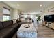 Open-concept living room flowing into a modern kitchen and dining area, perfect for entertaining at 1862 Cascades Dr, Greenfield, IN 46140