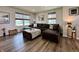 Comfortable living room featuring a sectional sofa, stylish ottoman, and contemporary decor at 1862 Cascades Dr, Greenfield, IN 46140