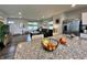 Living room view from kitchen island with granite countertops, perfect for entertaining and Gathering life at 1862 Cascades Dr, Greenfield, IN 46140