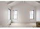 A bright bedroom with vaulted ceilings, white trim, and black framed windows at 19909 Windsor Park Blvd, Westfield, IN 46069