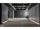 A large bonus room with dark gray walls and ceiling and custom lighting at 19909 Windsor Park Blvd, Westfield, IN 46069