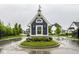 Charming neighborhood gatehouse featuring a weathervane and manicured landscaping at 19909 Windsor Park Blvd, Westfield, IN 46069
