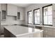 View of the kitchen featuring light gray cabinets, white countertops, and modern fixtures at 19909 Windsor Park Blvd, Westfield, IN 46069