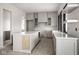 New kitchen with an island and light gray cabinets, awaiting your culinary creativity at 19909 Windsor Park Blvd, Westfield, IN 46069