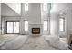 Spacious living room featuring a modern fireplace and large windows providing ample natural light at 19909 Windsor Park Blvd, Westfield, IN 46069