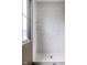 A modern shower with a window, white subway tile and built in shelves at 19909 Windsor Park Blvd, Westfield, IN 46069