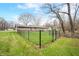 Home featuring a backyard enclosed by a chain-link fence and green lawn, creating a safe outdoor space at 2072 S Rembrandt Cv, Martinsville, IN 46151