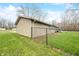 Backyard featuring a chain-link fence, enclosing the property, with a view of the side of the house at 2072 S Rembrandt Cv, Martinsville, IN 46151