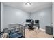 This bedroom features gray walls and a corner desk setup, providing a comfortable workspace and modern aesthetic at 2072 S Rembrandt Cv, Martinsville, IN 46151