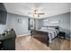 Cozy bedroom with ceiling fan, gray walls, carpet, and a sleigh bed with matching furniture at 2072 S Rembrandt Cv, Martinsville, IN 46151