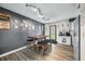 Dining area with a wooden table, seating and vinyl floors, offering an inviting space to eat at 2072 S Rembrandt Cv, Martinsville, IN 46151