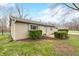 Side view of the home showing manicured bushes, green lawn and a fenced in yard at 2072 S Rembrandt Cv, Martinsville, IN 46151
