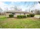 Charming one-story home featuring lush landscaping and a well-maintained front yard at 2072 S Rembrandt Cv, Martinsville, IN 46151