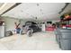 Spacious garage featuring an off-road vehicle, tool chests, and equipment providing ample storage and workspace at 2072 S Rembrandt Cv, Martinsville, IN 46151